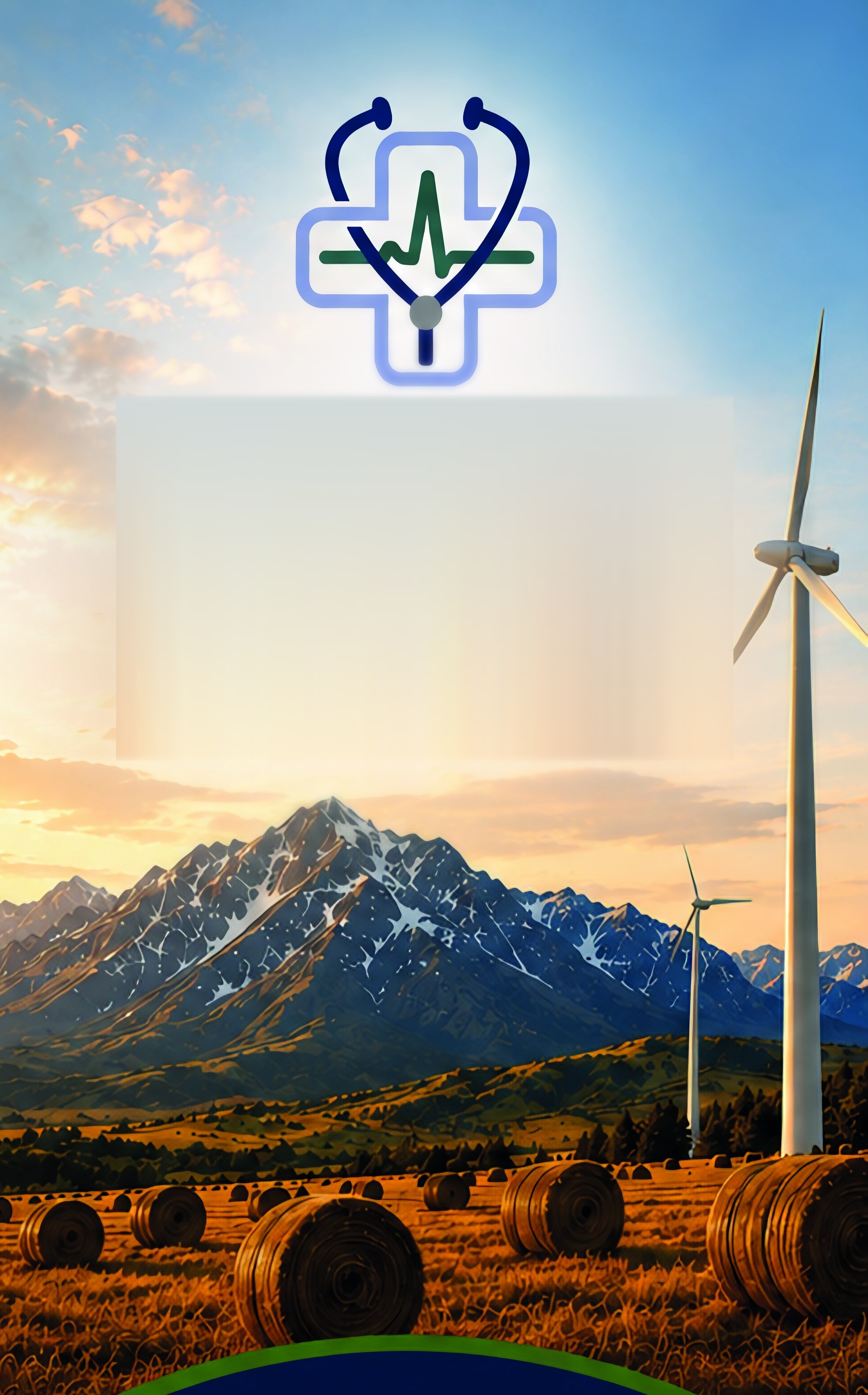 Wind turbines over hay fields beneath the Rockies
